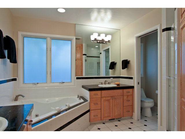 205 Galli Drive Los Altos, CA 94022 - Photo 11 of 20 a bathroom with a sink a vanity and a mirror