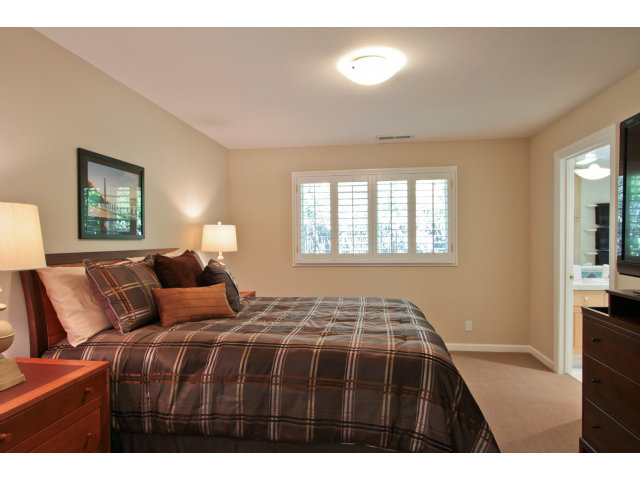 205 Galli Drive Los Altos, CA 94022 - Photo 12 of 20 a bedroom with a bed and a night stand