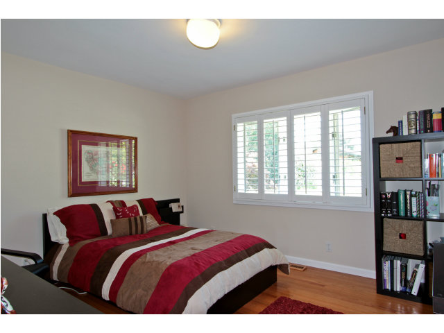 205 Galli Drive Los Altos, CA 94022 - Photo 13 of 20 a bedroom with a bed and wooden floor