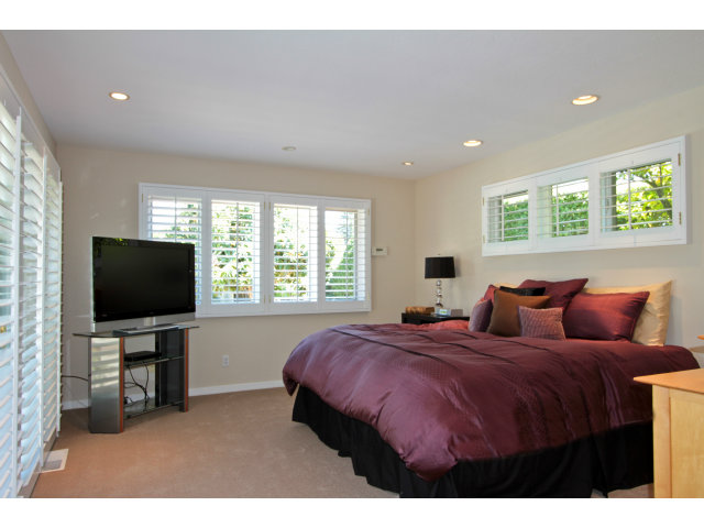 205 Galli Drive Los Altos, CA 94022 - Photo 10 of 20 a bedroom with bed and a flat screen tv