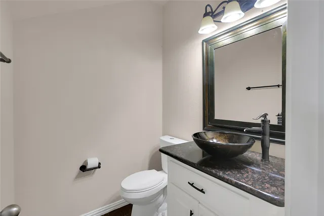 an empty room with a ceiling fan and a window