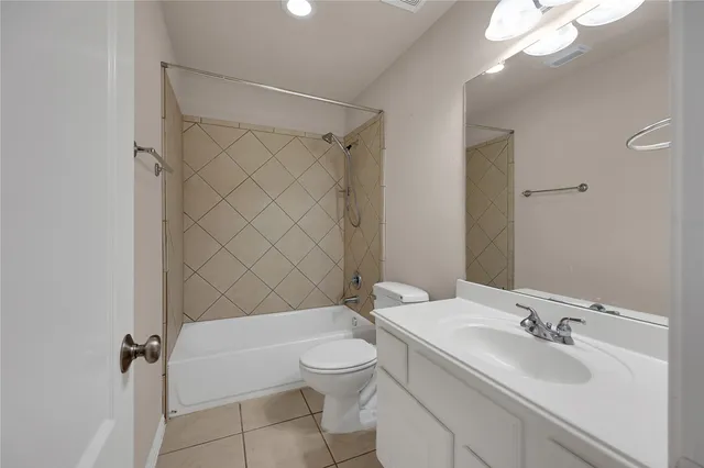 a view of a livingroom with a ceiling fan and window