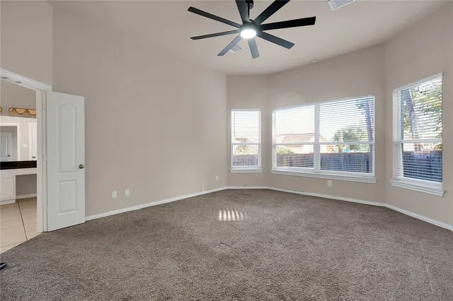 a large white bathroom with a sink a mirror and a bathtub