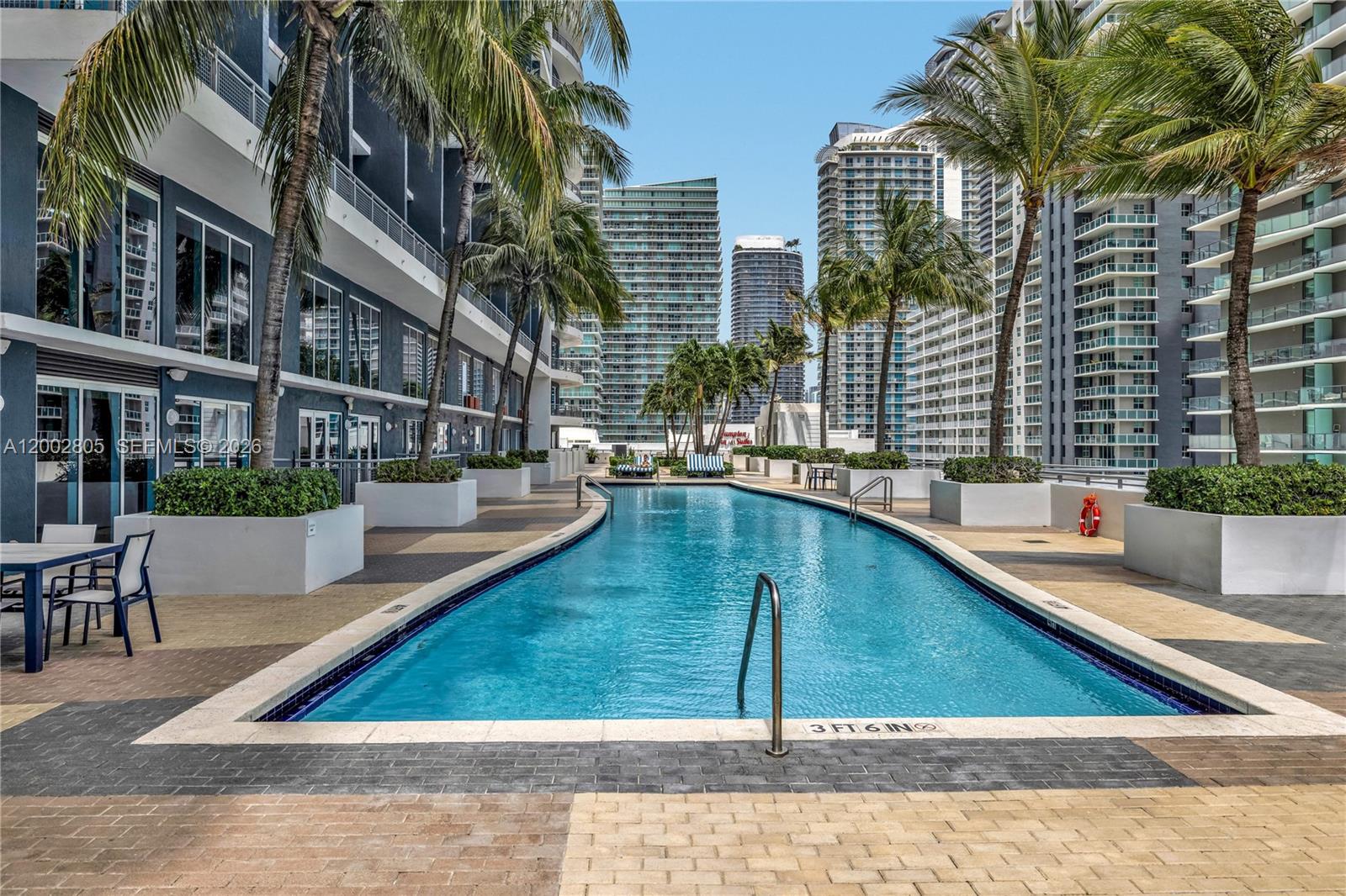 60 Southwest 13th Street, Unit 1124 Miami, FL 33130 - Photo 26 of 30 a view of swimming pool with outdoor seating