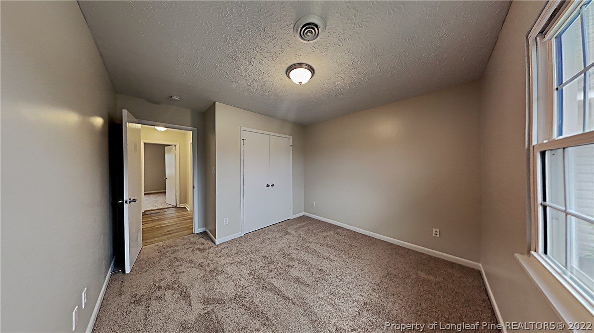 6536 Grist Mill Road Fayetteville, NC 28314 - Photo 13 of 20 an empty room with windows