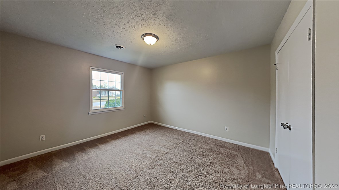 6536 Grist Mill Road Fayetteville, NC 28314 - Photo 15 of 20 an empty room with windows