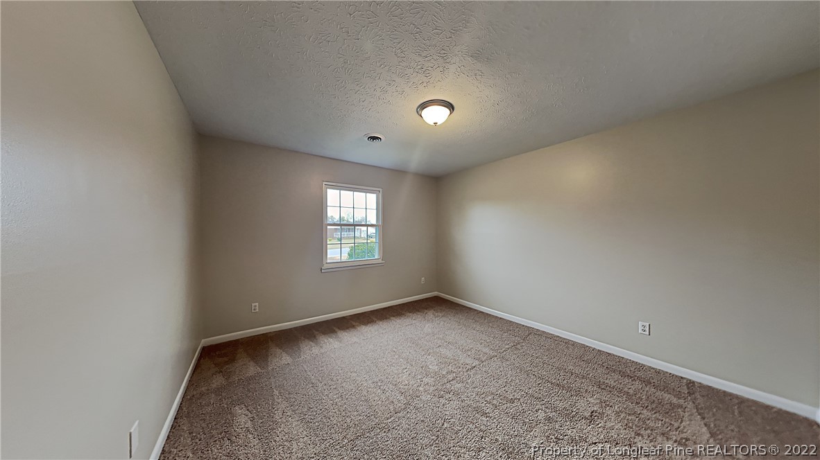 6536 Grist Mill Road Fayetteville, NC 28314 - Photo 16 of 20 an empty room with a window