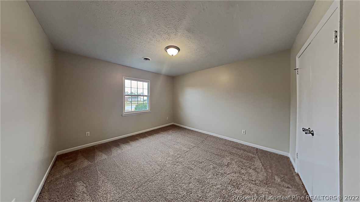6536 Grist Mill Road Fayetteville, NC 28314 - Photo 19 of 20 a view of an empty room and window