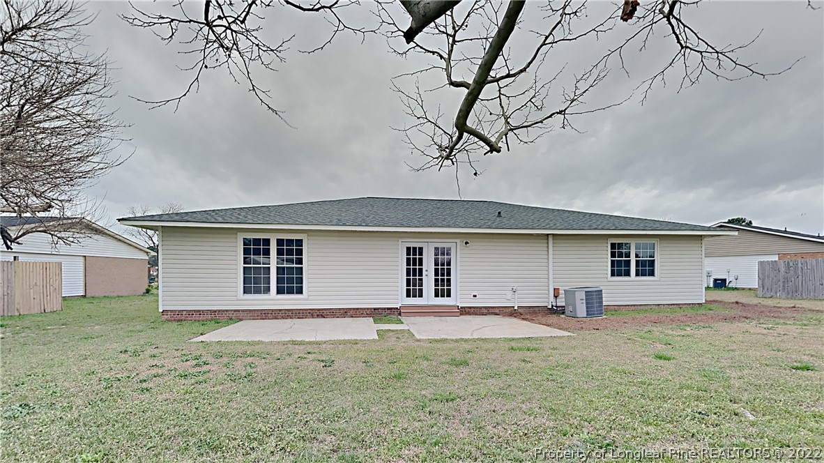 6536 Grist Mill Road Fayetteville, NC 28314 - Photo 20 of 20 a view of a house with a yard and garage