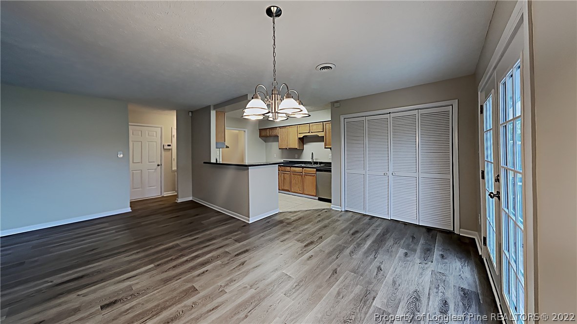 6536 Grist Mill Road Fayetteville, NC 28314 - Photo 7 of 20 a view of a kitchen cabinets and wooden floor