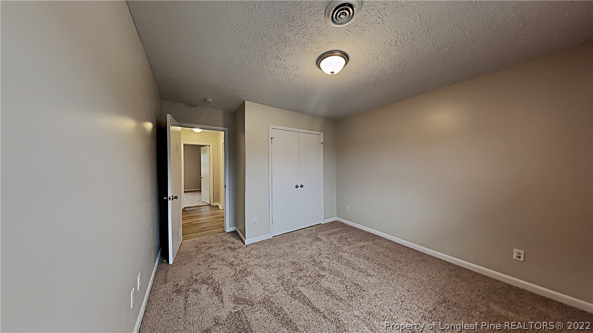 6536 Grist Mill Road Fayetteville, NC 28314 - Photo 9 of 20 an empty room with closet