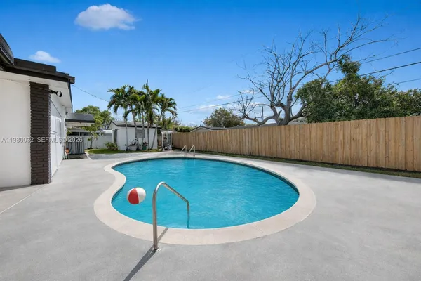 a view of outdoor space and swimming pool