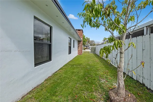 a view of a back yard of the house