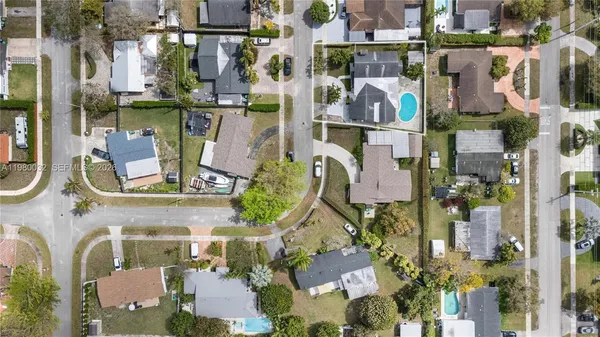 an aerial view of houses with outdoor space