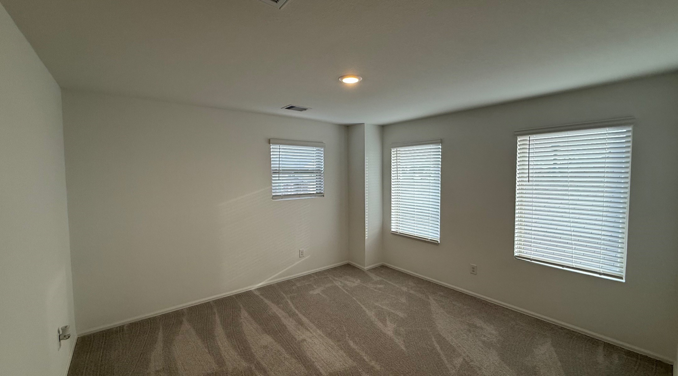 18926 Panzini Drive New Caney, TX 77357 - Photo 18 of 23 an empty room with windows