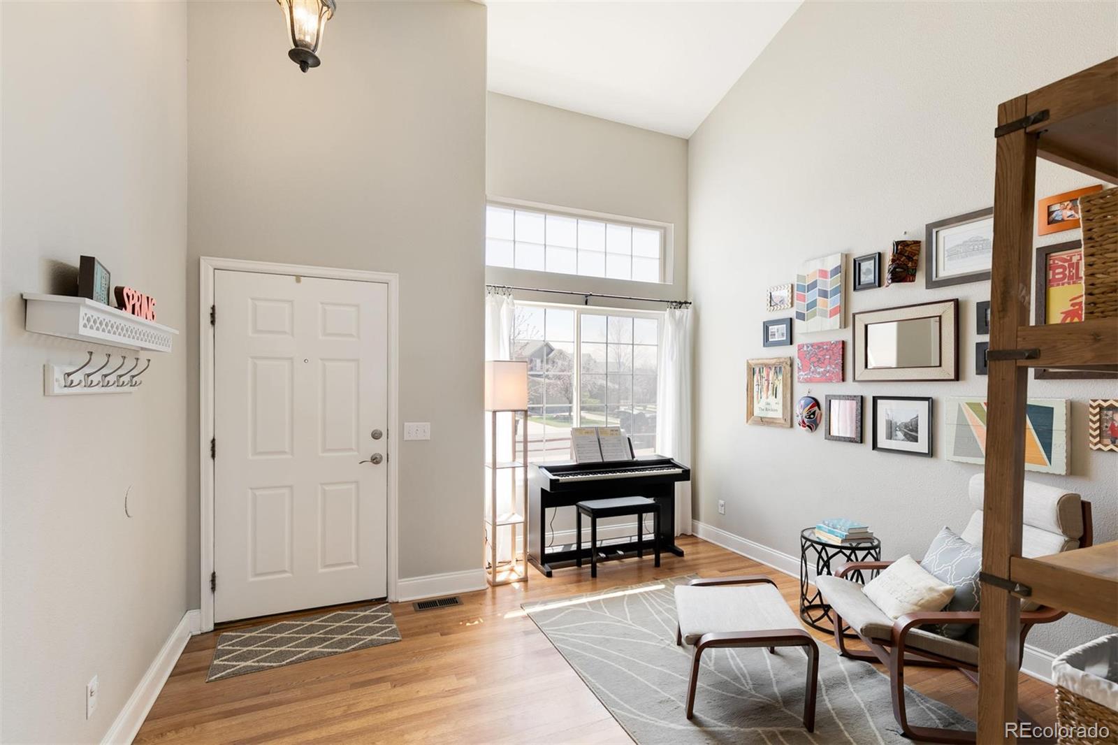877 Timbervale Trail Highlands Ranch, CO 80129 - Photo 2 of 34 a view of a workspace with furniture and a window