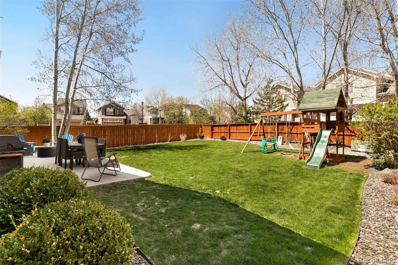 877 Timbervale Trail Highlands Ranch, CO 80129 - Photo 28 of 34 a view of a garden with a slide