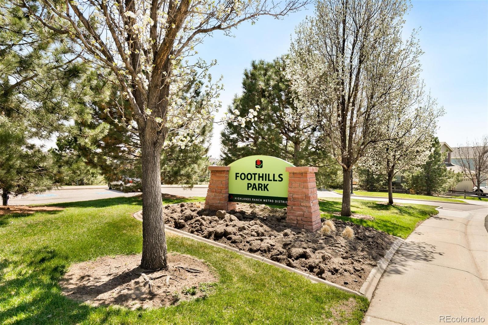 877 Timbervale Trail Highlands Ranch, CO 80129 - Photo 32 of 34 a sign board with a yard