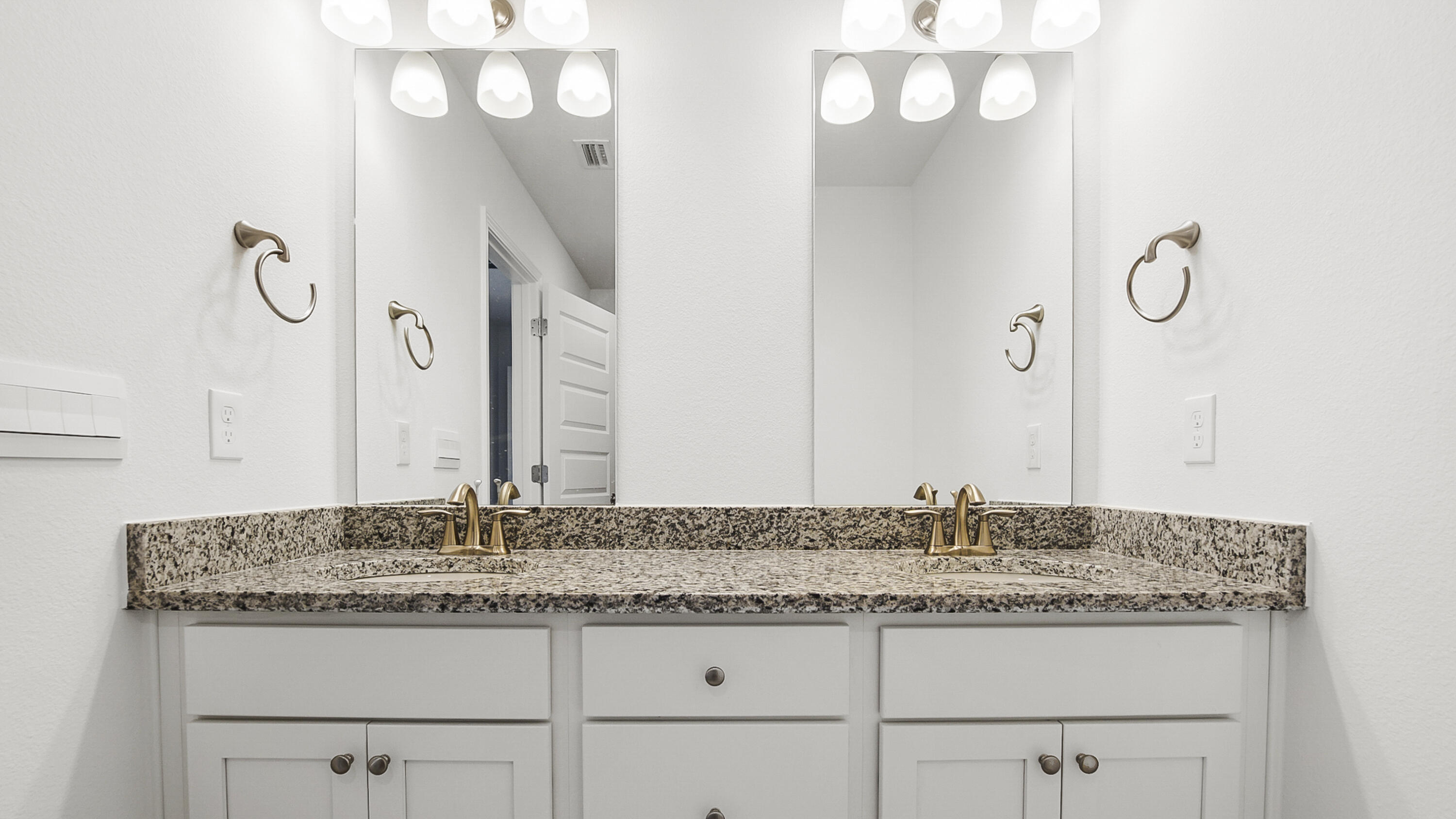 30 Phoenix Street Santa Rosa Beach, FL 32459 - Photo 23 of 34 a bathroom with a granite countertop sink and a mirror