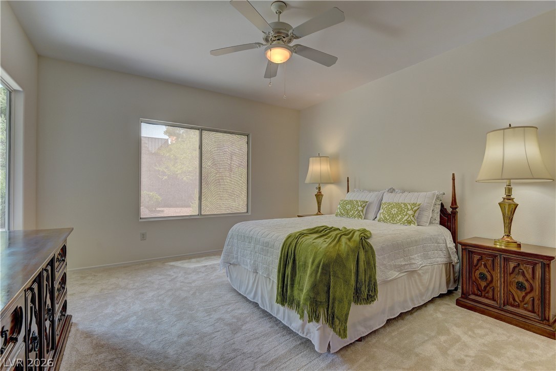 3013 Fort Stanwix Road Henderson, NV 89052 - Photo 16 of 26 Bedroom featuring carpet floors and a ceiling fan