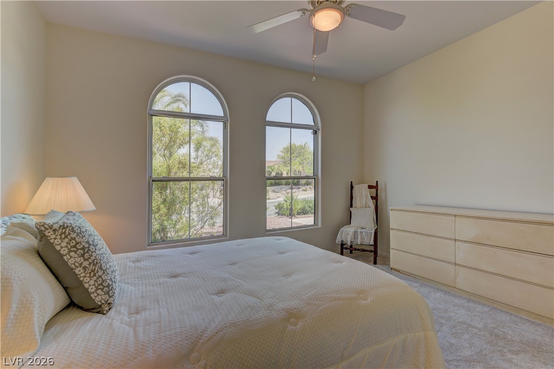 3013 Fort Stanwix Road Henderson, NV 89052 - Photo 21 of 26 Bedroom with a ceiling fan and carpet flooring