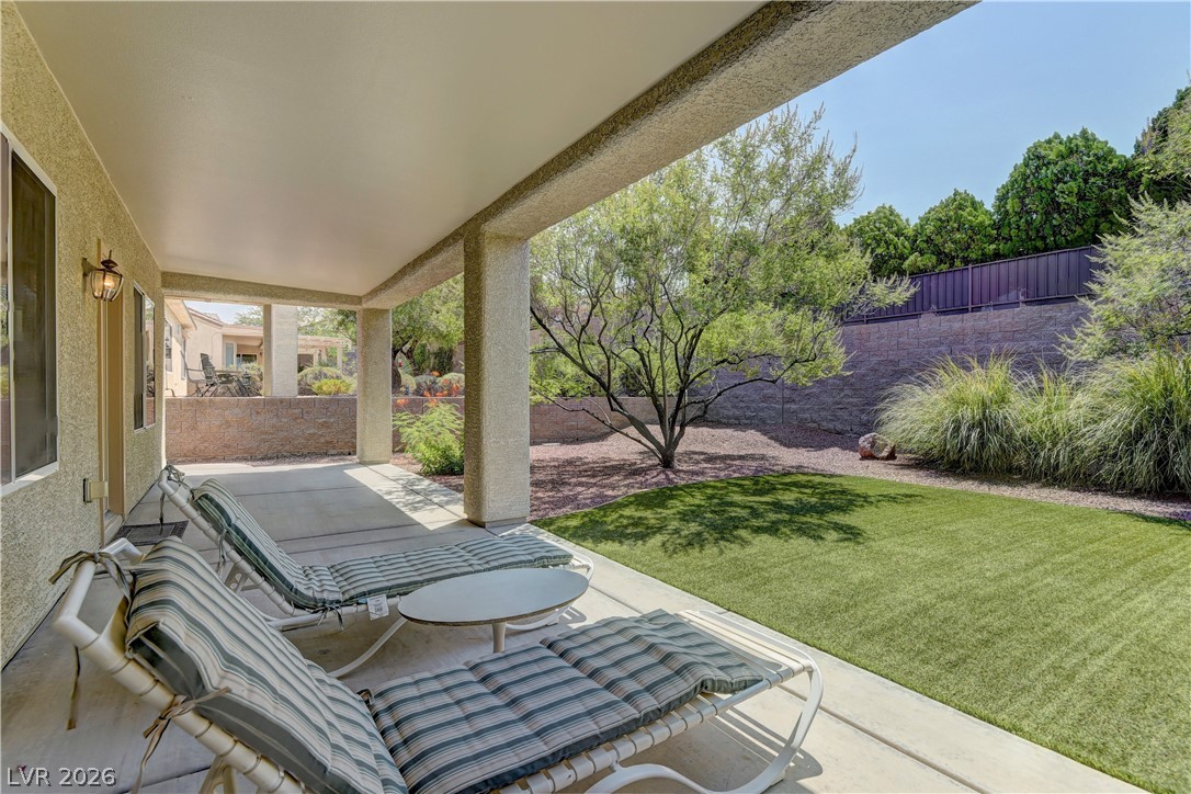 3013 Fort Stanwix Road Henderson, NV 89052 - Photo 24 of 26 Fenced backyard with a patio
