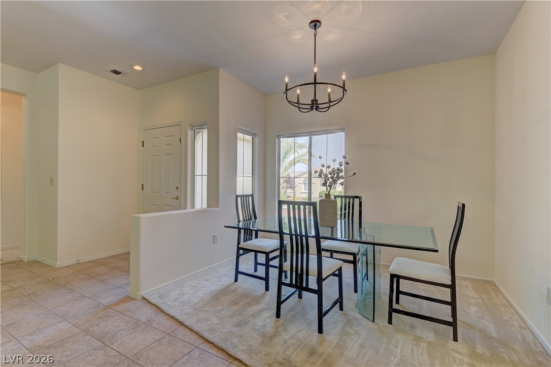 3013 Fort Stanwix Road Henderson, NV 89052 - Photo 6 of 26 Dining room with a chandelier and light tile patterned floors