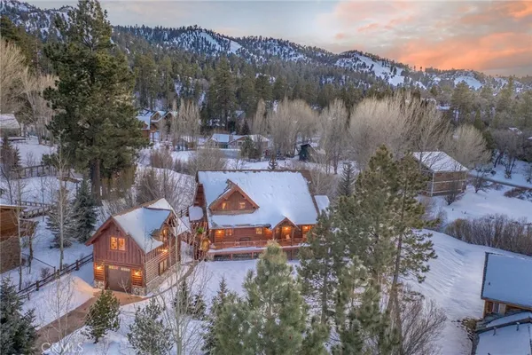 an aerial view of a house with lake view