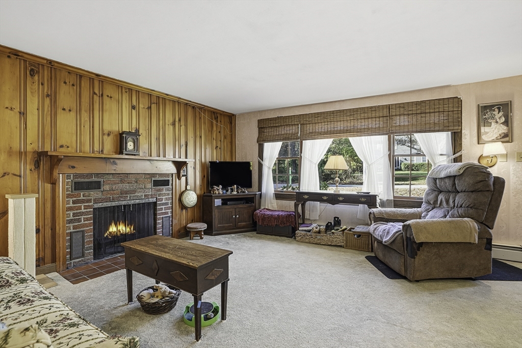 39 Mechanic Street Upton, MA 01568 - Photo 11 of 35 a living room with furniture and a fireplace