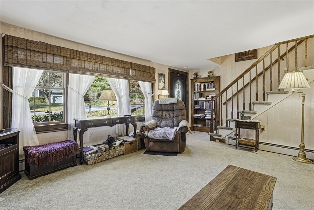39 Mechanic Street Upton, MA 01568 - Photo 12 of 35 a living room with furniture and a large window