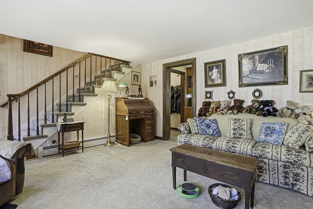 39 Mechanic Street Upton, MA 01568 - Photo 13 of 35 a living room with furniture and a flat screen tv