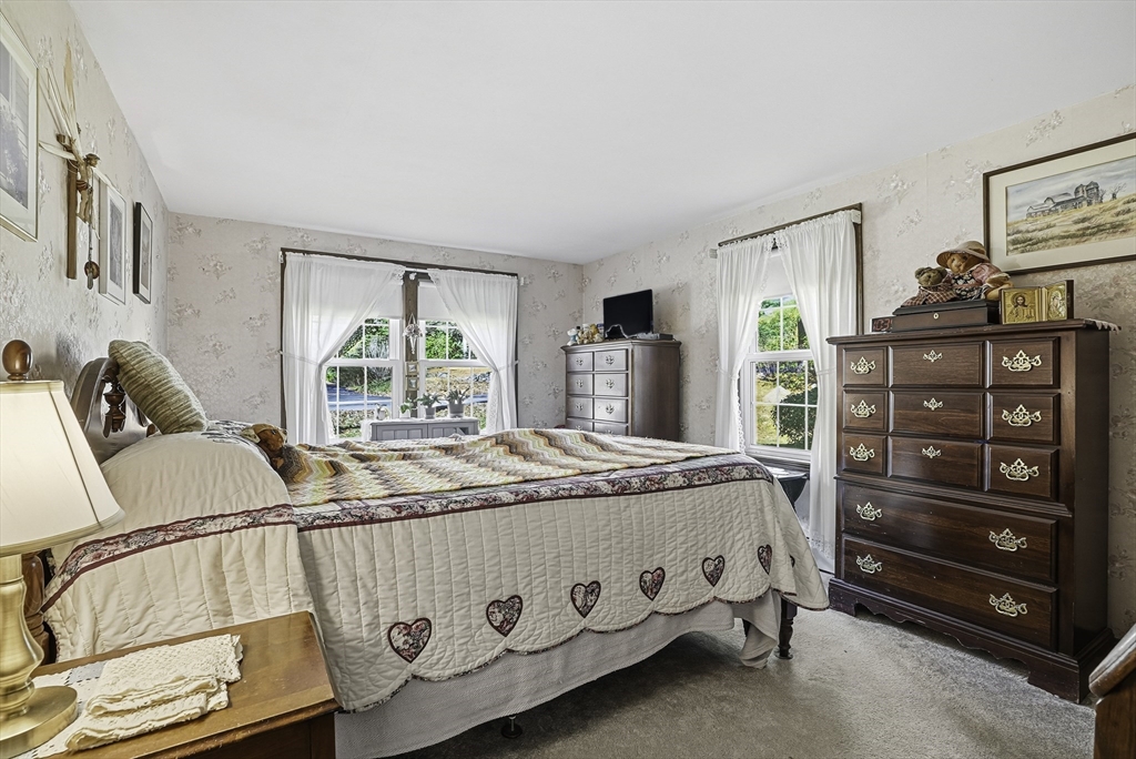 39 Mechanic Street Upton, MA 01568 - Photo 14 of 35 a bedroom with a bed and a window