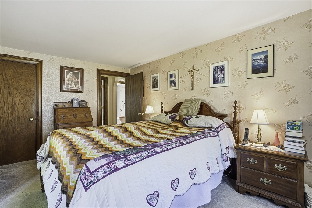 39 Mechanic Street Upton, MA 01568 - Photo 16 of 35 a bedroom with a bed and a dresser