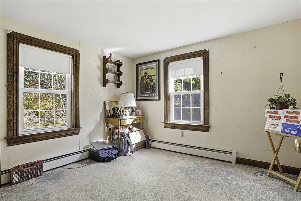 39 Mechanic Street Upton, MA 01568 - Photo 17 of 35 a view of a room with gym equipment and a window