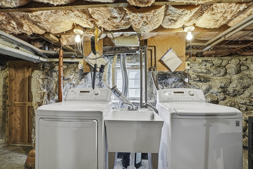39 Mechanic Street Upton, MA 01568 - Photo 25 of 35 a utility room with a sink dryer and washer