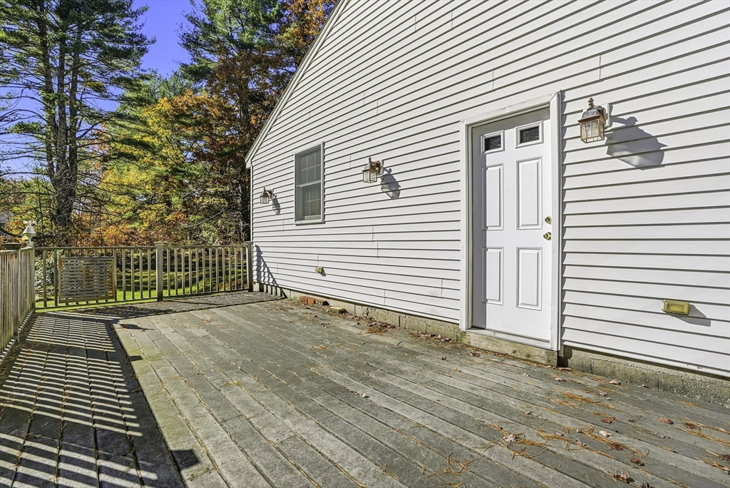 39 Mechanic Street Upton, MA 01568 - Photo 26 of 35 a view of a backyard with a small cabin