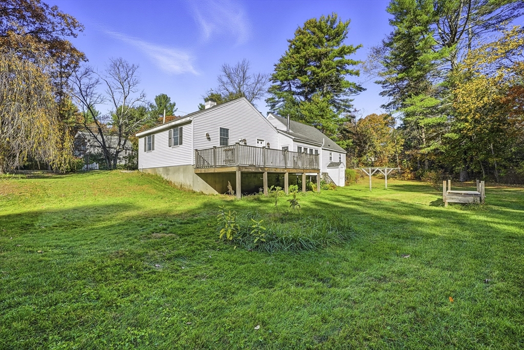 39 Mechanic Street Upton, MA 01568 - Photo 29 of 35 a view of a house with a big yard and large trees