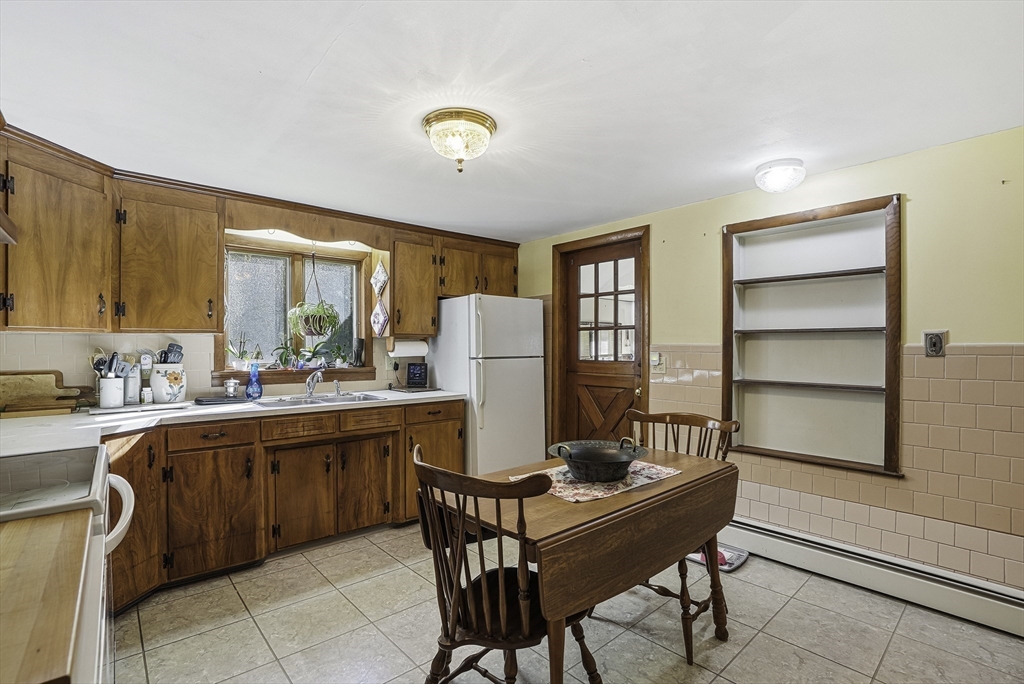 39 Mechanic Street Upton, MA 01568 - Photo 6 of 35 a room with a table chairs and a window