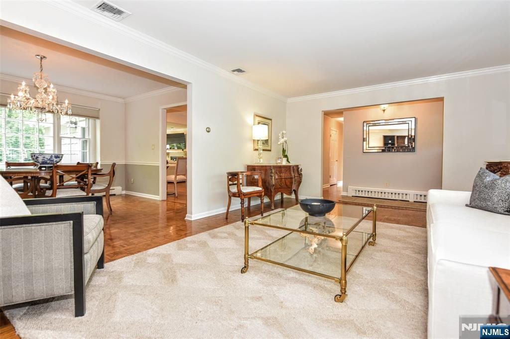 60 Dimmig Road Upper Saddle River, NJ 07458 - Photo 13 of 40 a living room with furniture and a table
