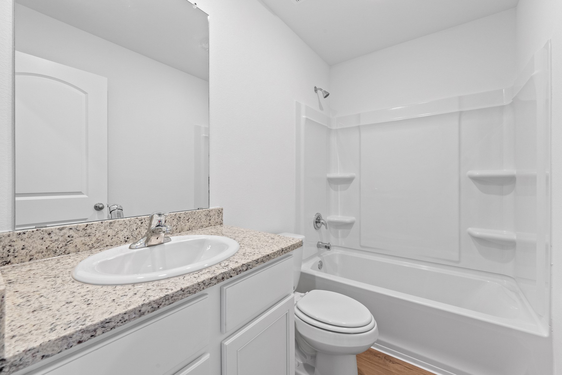 314 Low Pasture Trail Maxwell, TX 78656 - Photo 10 of 10 a bathroom with a granite countertop sink a toilet and a bathtub