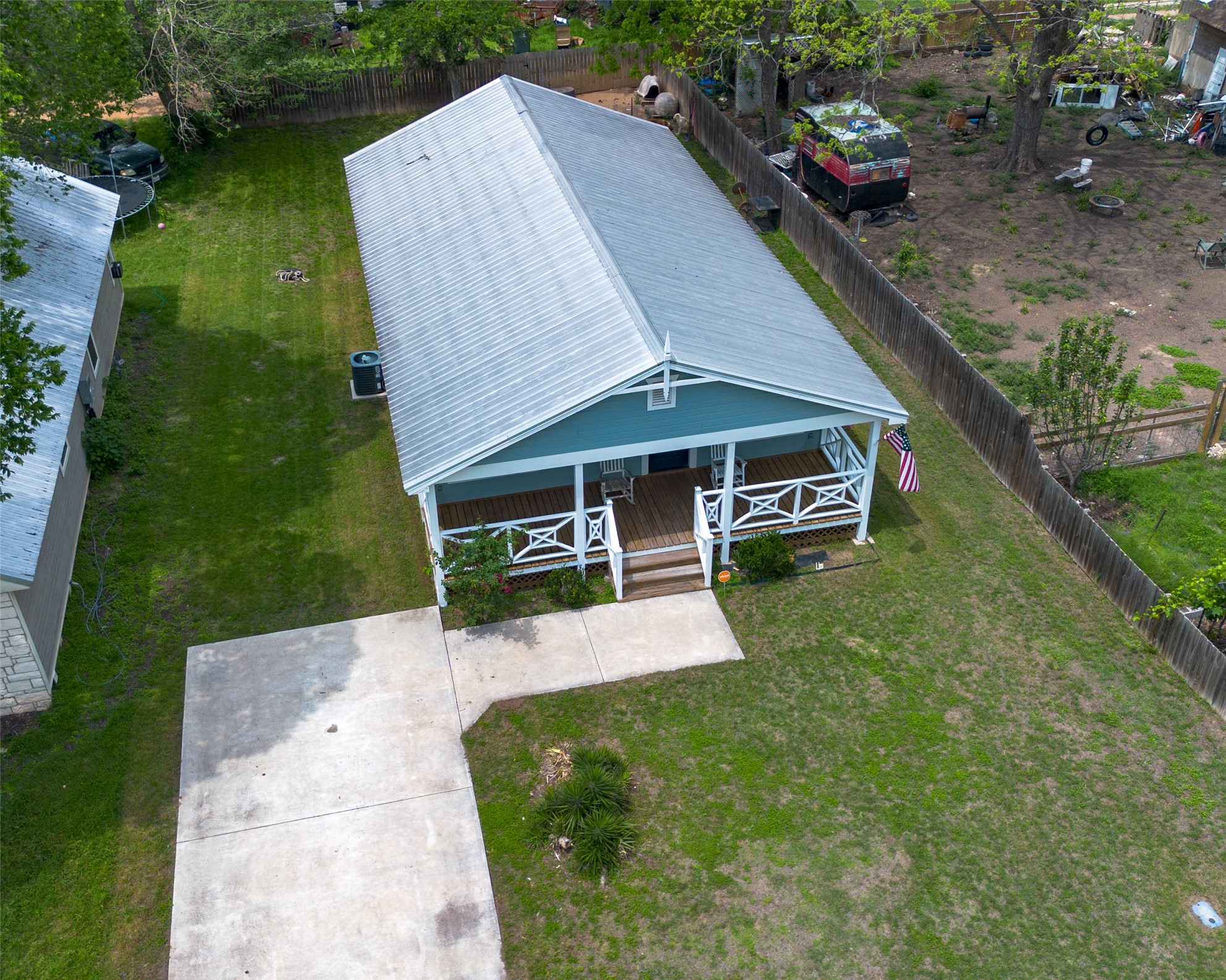 404 Rivers Street Smithville, TX 78957 - Photo 23 of 27 Single-story residence featuring a powder blue exterior and a light-colored metal roof