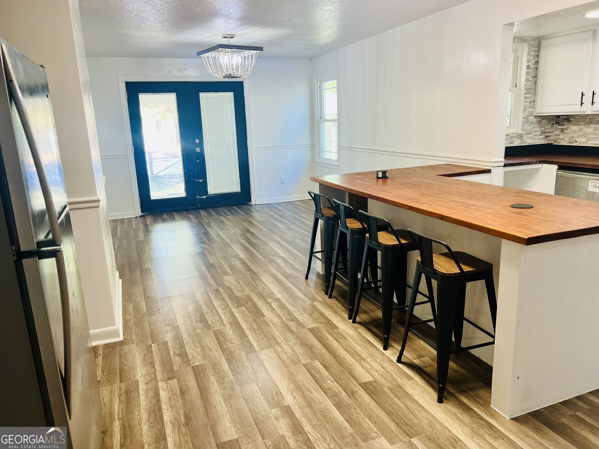 594 South 3rd Street Jesup, GA 31545 - Photo 14 of 32 a dining room with wooden floor and entrance
