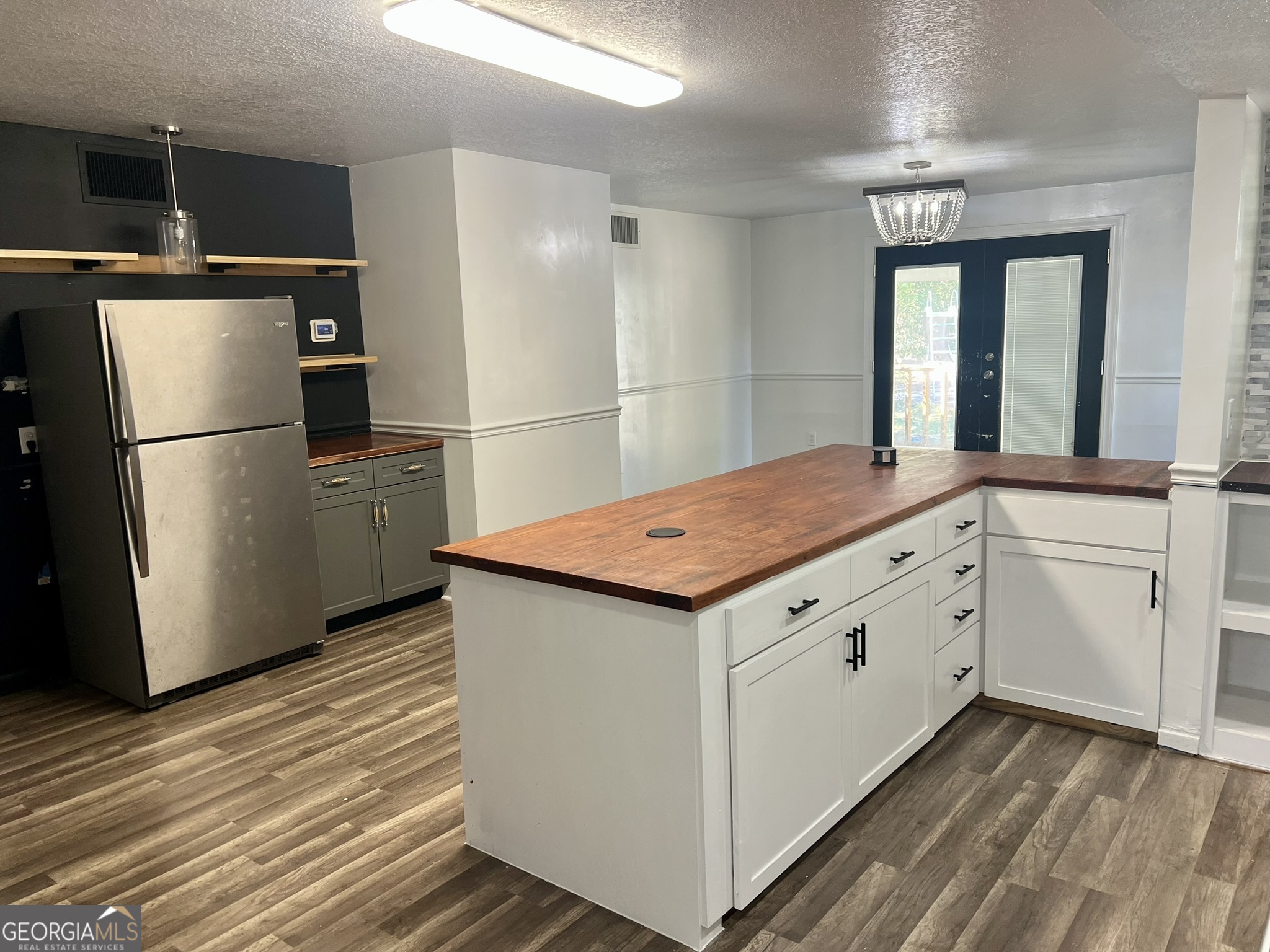 594 South 3rd Street Jesup, GA 31545 - Photo 15 of 32 a kitchen with a refrigerator and countertop