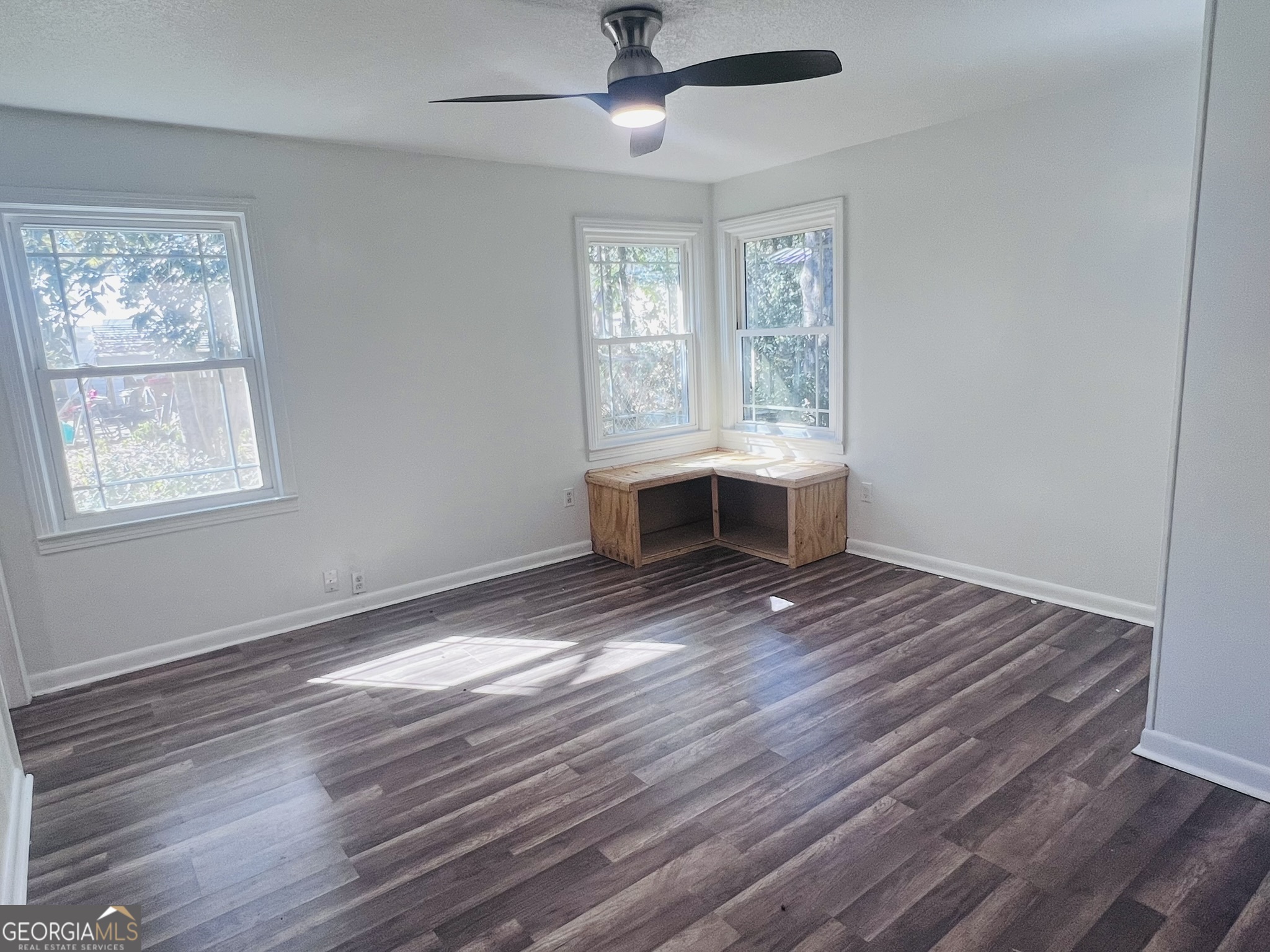 594 South 3rd Street Jesup, GA 31545 - Photo 19 of 32 a view of a room with wooden floor and window
