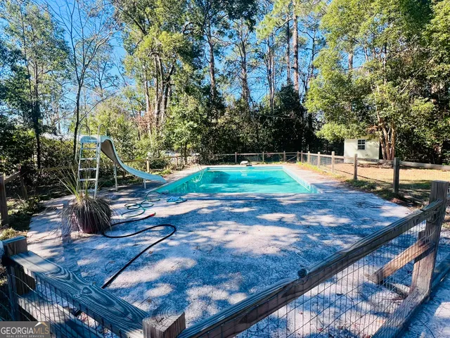 a view of a backyard with sitting area