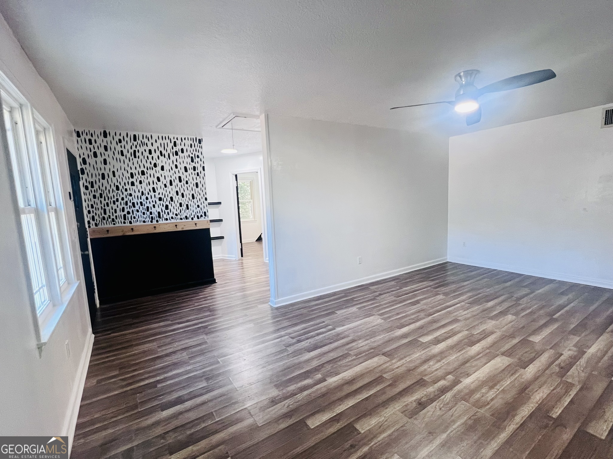 594 South 3rd Street Jesup, GA 31545 - Photo 10 of 32 a view of empty room with wooden floor