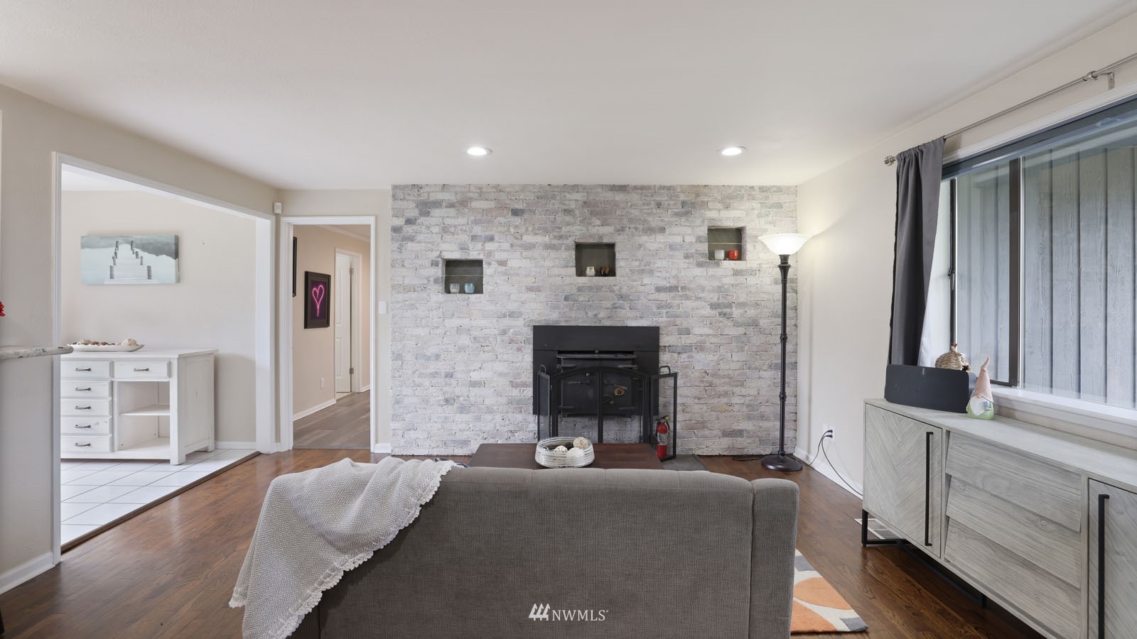 123 234th Street Southwest Bothell, WA 98021 - Photo 11 of 38 a living room with furniture and a fireplace