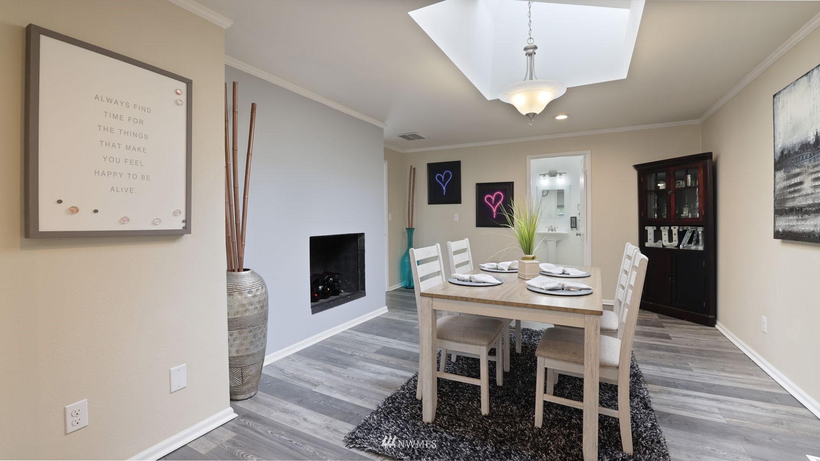 123 234th Street Southwest Bothell, WA 98021 - Photo 13 of 38 a view of a dining room with furniture and wooden floor