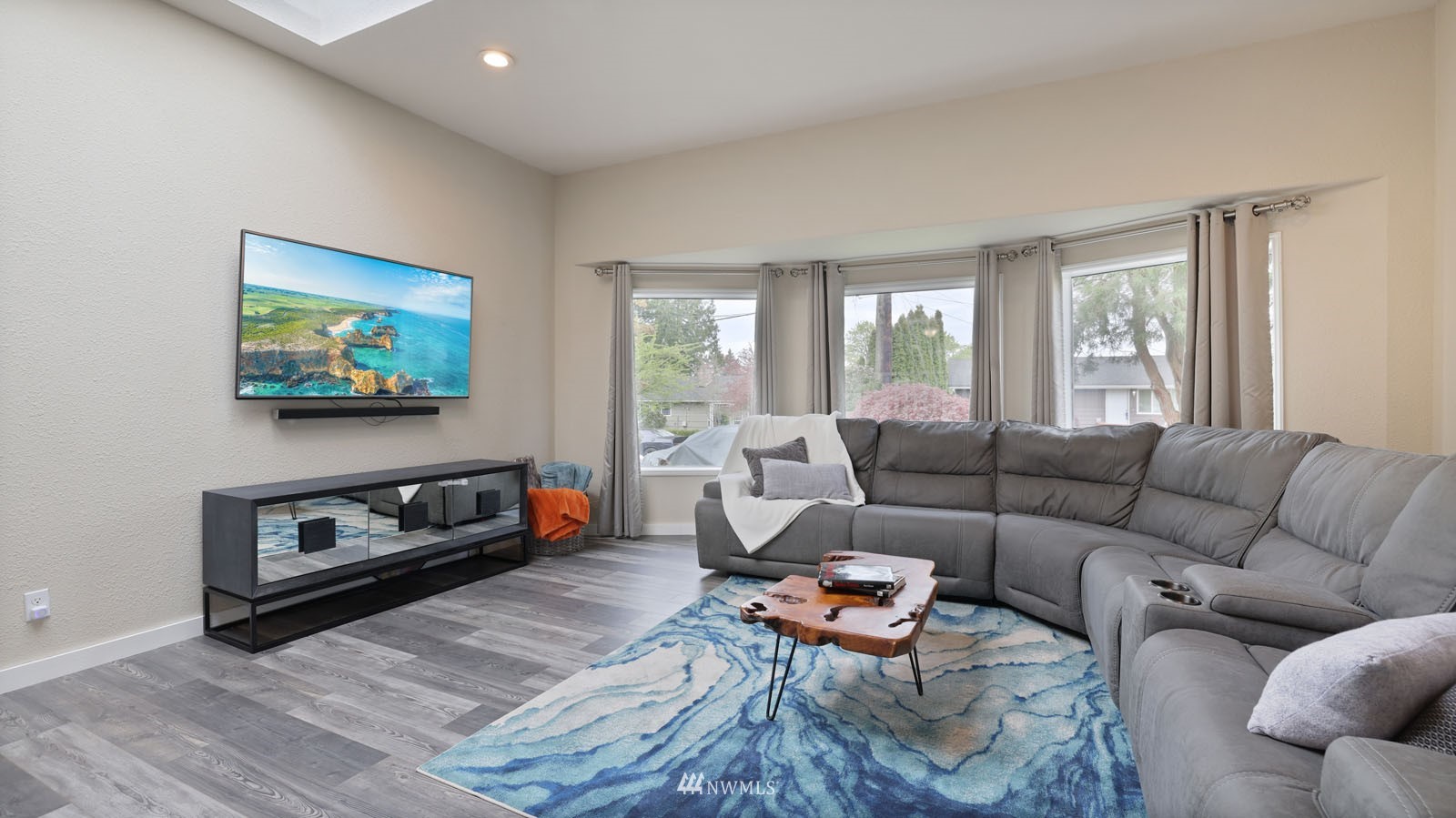 123 234th Street Southwest Bothell, WA 98021 - Photo 16 of 38 a living room with furniture a window and a flat screen tv