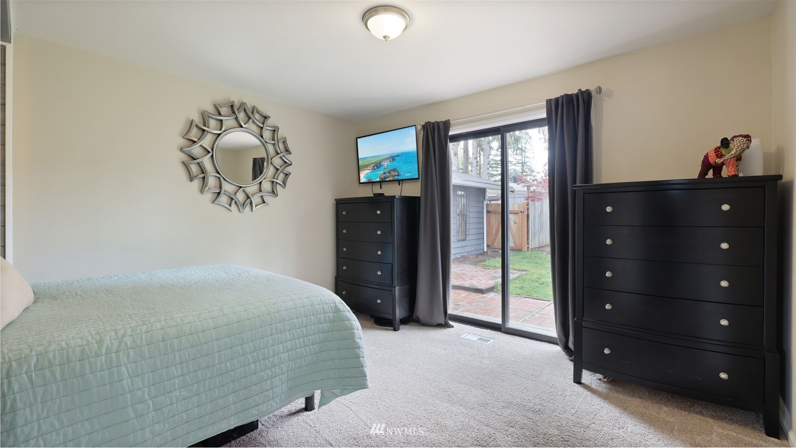 123 234th Street Southwest Bothell, WA 98021 - Photo 23 of 38 a bedroom with a bed and a dresser